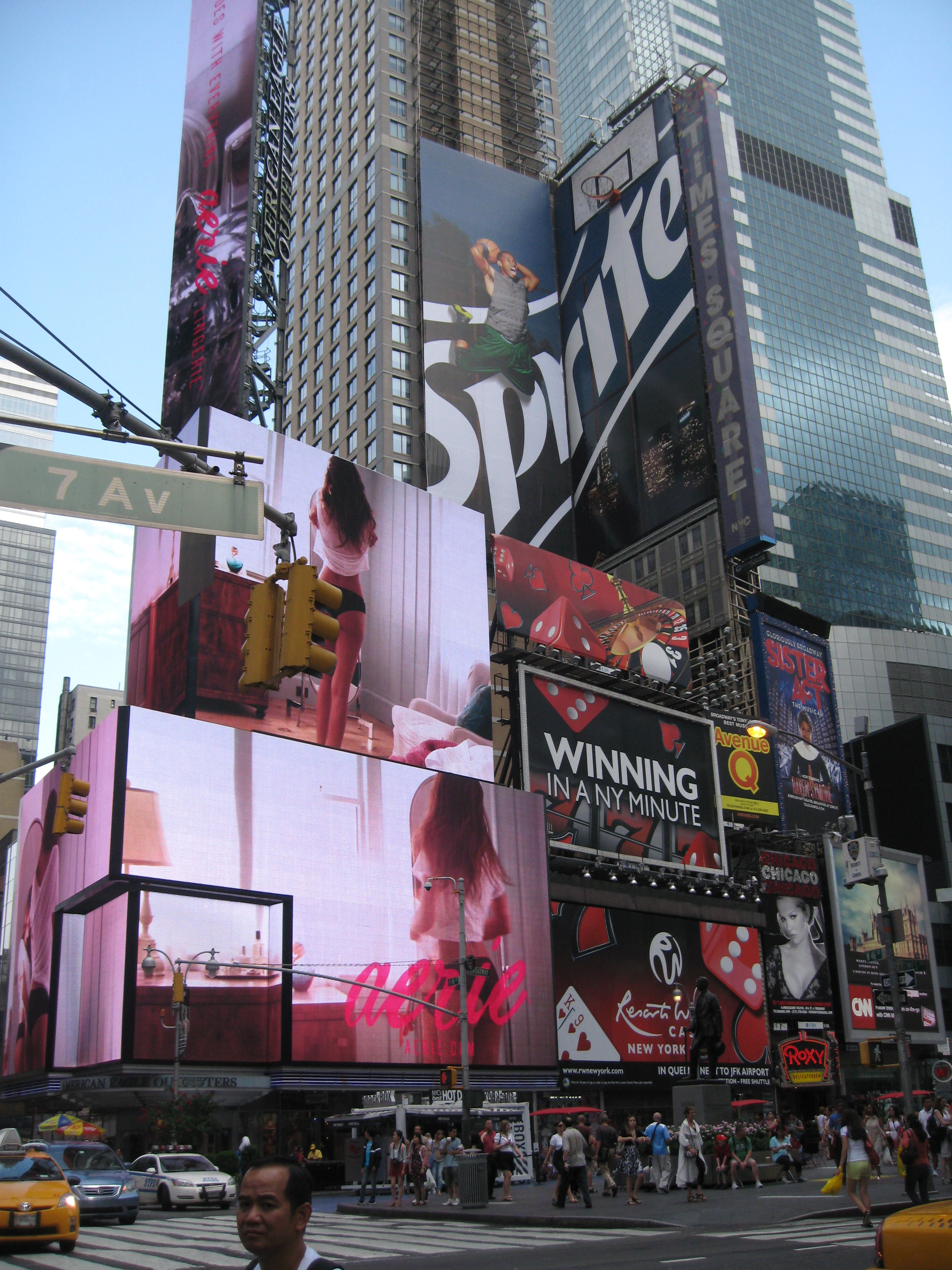 Times Square in New York City, featuring a movie, a play or just people watching. Photo by me.